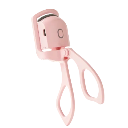 A light pink electric eyelash curler with a minimalist design, featuring a power button on the top and a small charging port on the side, set against a solid white background.